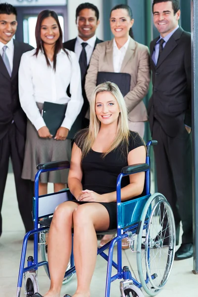 Disabled young businesswoman and team — Stock Photo, Image