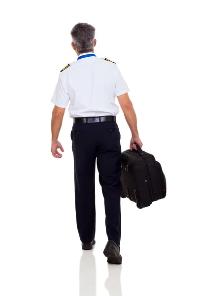 Rear view of senior captain walking — Stock Photo, Image