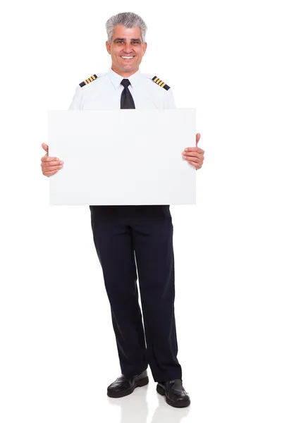 Pilote de ligne capitaine tenant tableau blanc — Photo