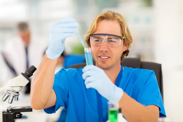 Medical researcher working with liquid tubes — Stock Photo, Image