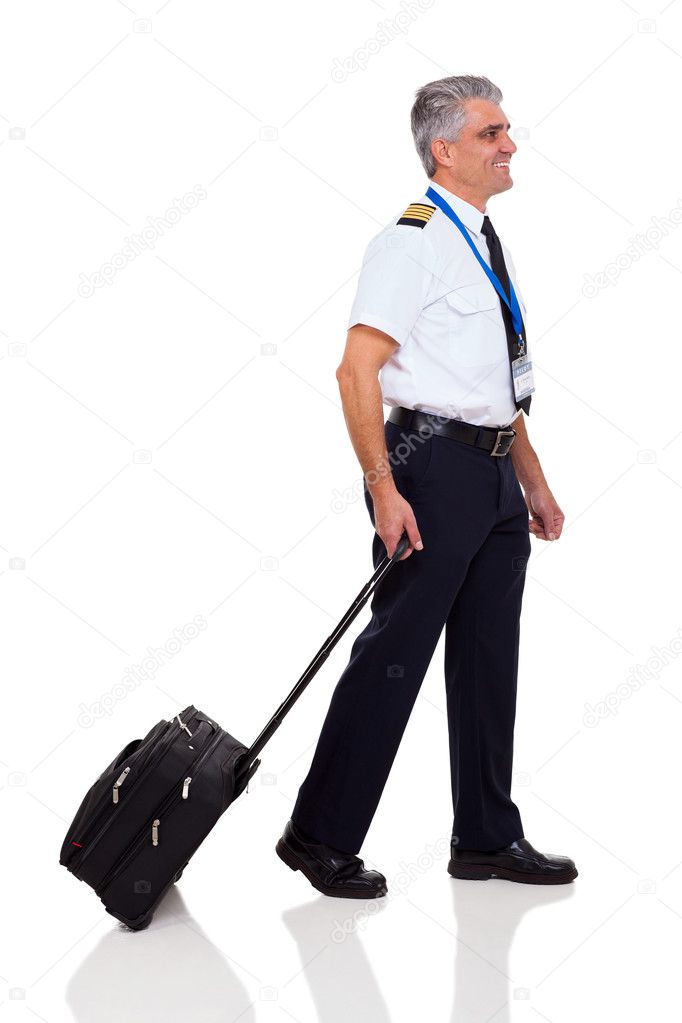 senior captain walking with briefcase