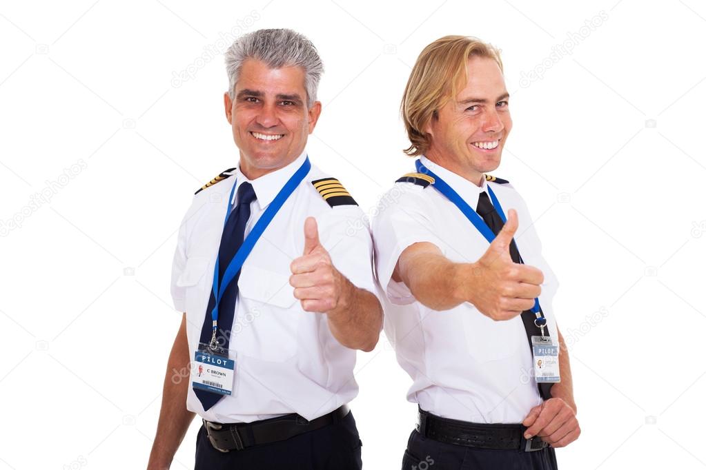 airline pilots giving thumbs up