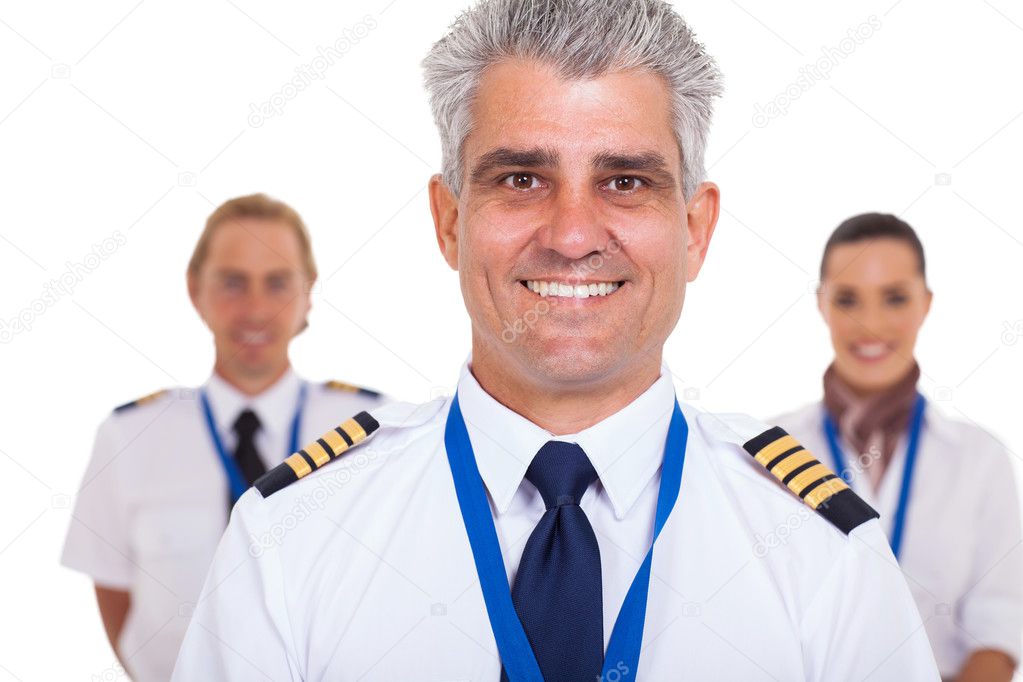 senior captain standing in front of airline crew