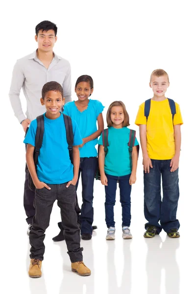 Young indian boy in front of classmates and teacher Stock Photo