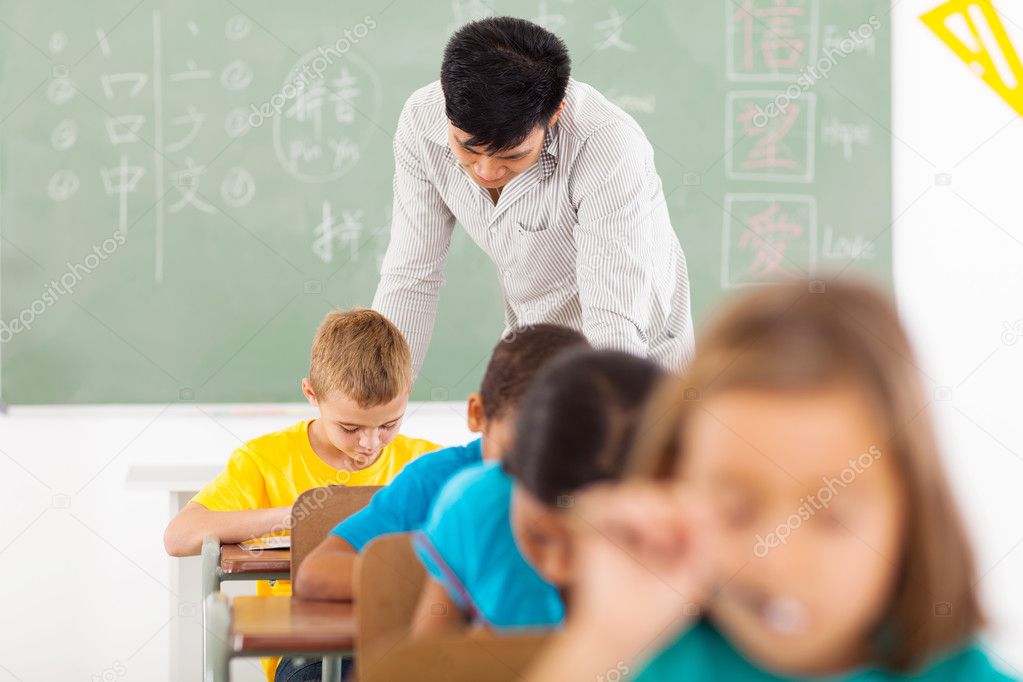 Chinese language teacher in classroom with students