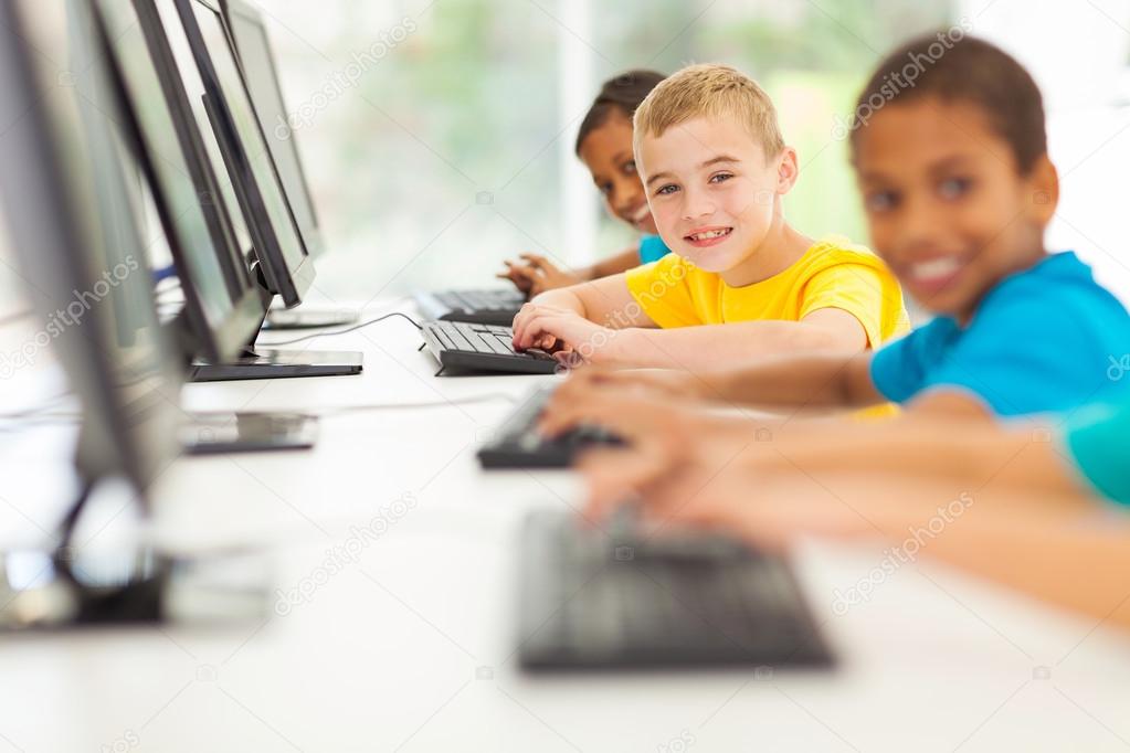 group of elementary school students in computer room