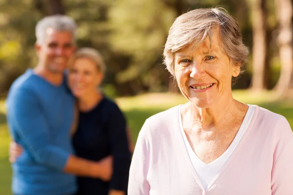Senior woman in front of middle aged son and daughter-in-law — Stock Photo, Image