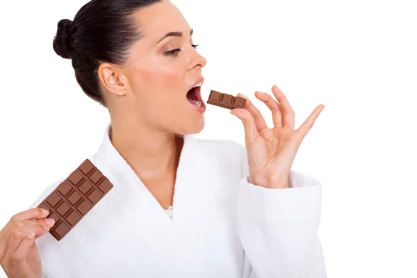 Beautiful woman eating chocolate — Stock Photo, Image