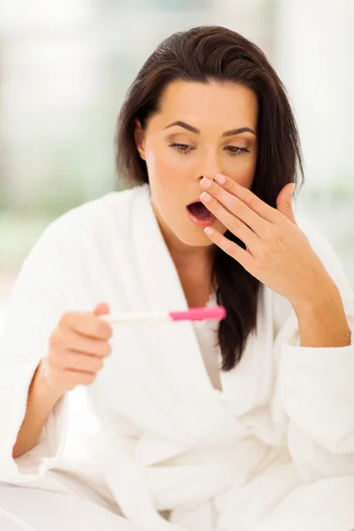 Young woman got shocked when pregnancy test showing positive res — Stock Photo, Image