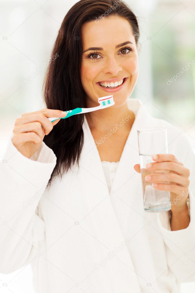 woman brushing teeth