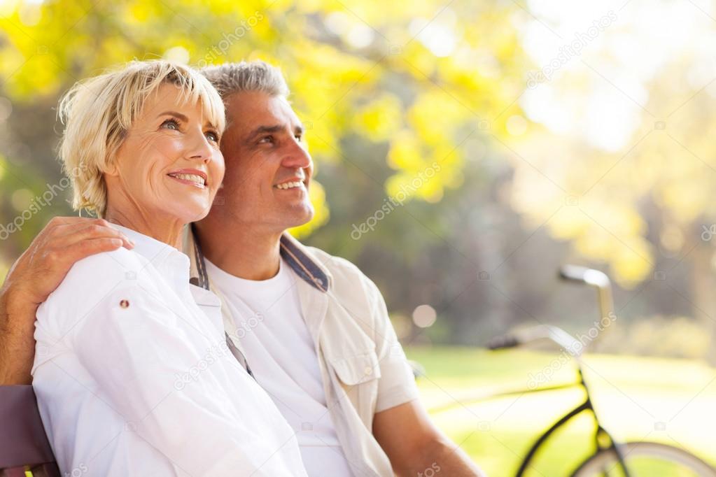 elegant mature couple sitting outdoors