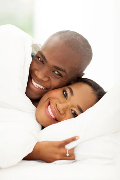 African couple sleeping in bed — Stock Photo, Image