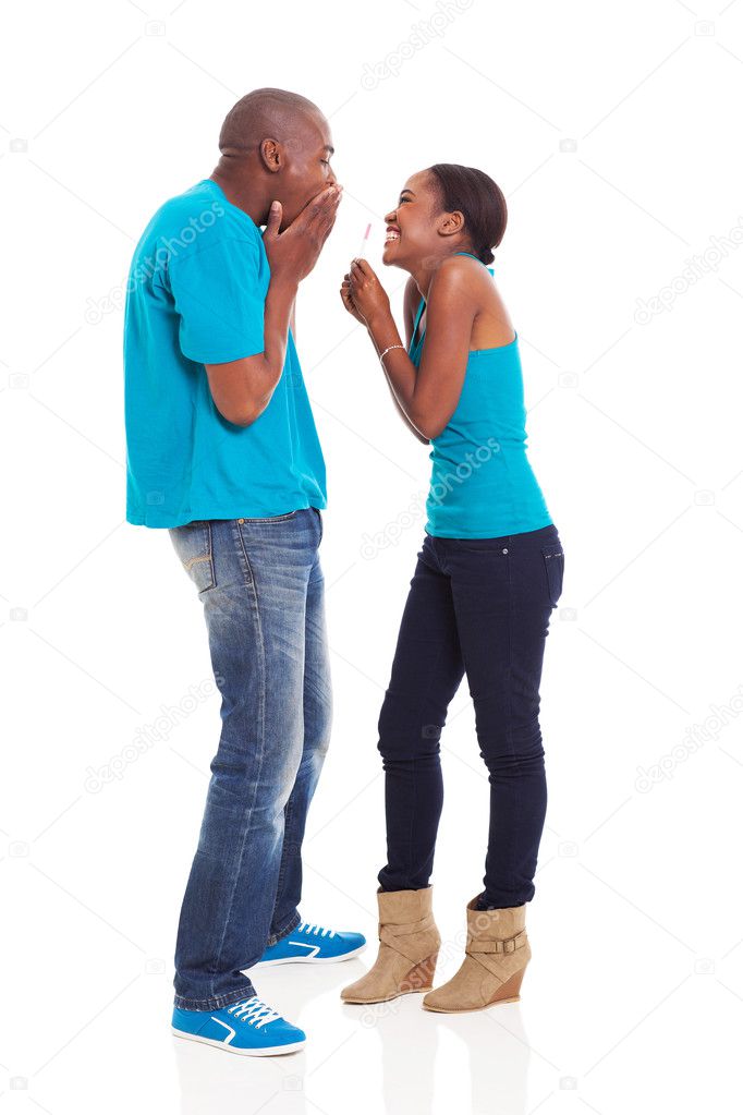 African girl showing her boyfriend home pregnancy test