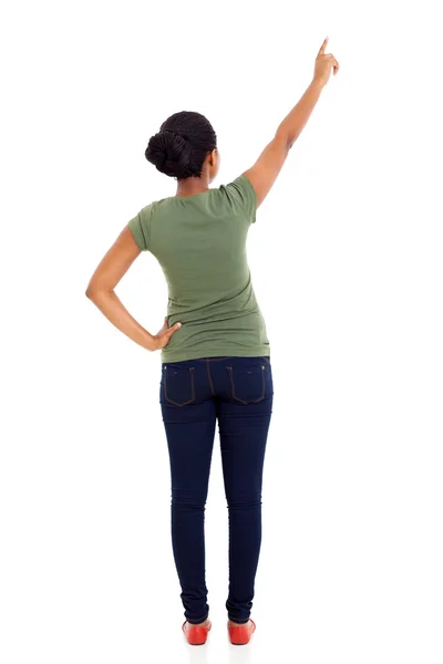 Rear view of african american woman pointing — Stock Photo, Image