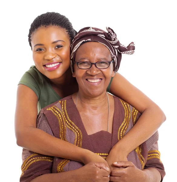 Pretty african daughter hugging senior mother — Stock Photo, Image