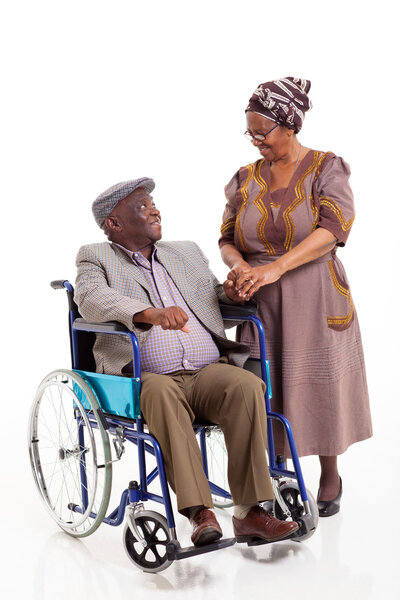 senior african wife talking to handicapped husband