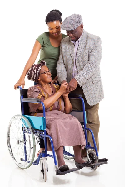 Disabled senior african woman with husband and granddaughter — Stock Photo, Image