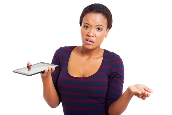 Unhappy african american woman holding tablet computer — Stock Photo, Image