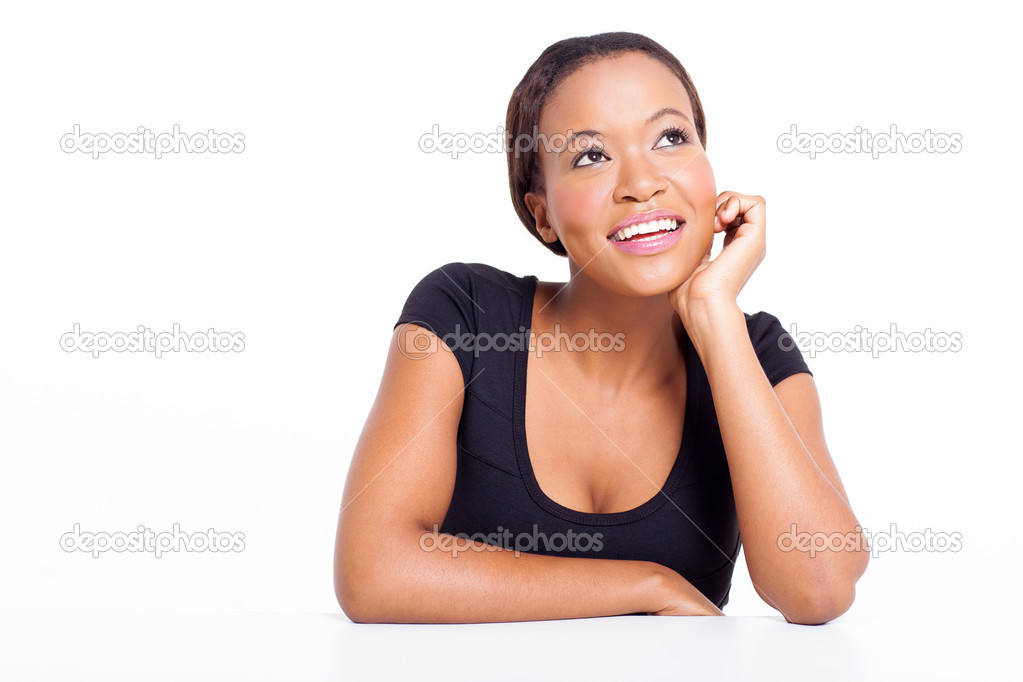 young african businesswoman daydreaming