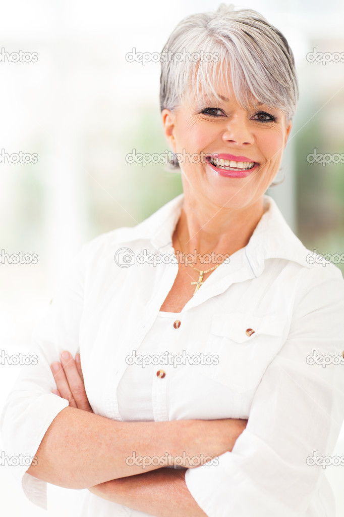 middle aged woman with arms folded