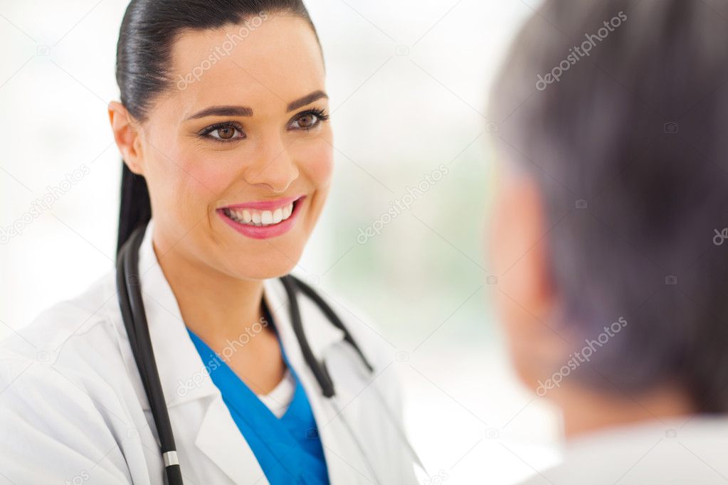 medical doctor talking to senior patient