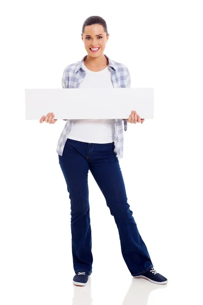 Young woman in casual clothes holding banner — Stock Photo, Image