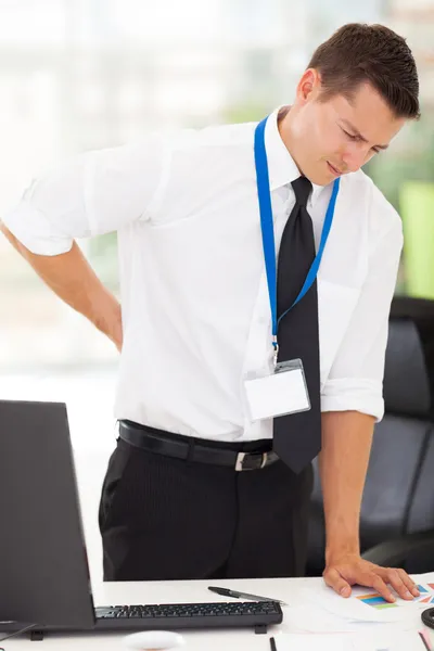 Hombre de negocios con dolor de espalda baja — Foto de Stock