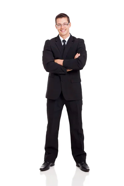 Бизнесмен в костюме со скрещенными руками — стоковое фото