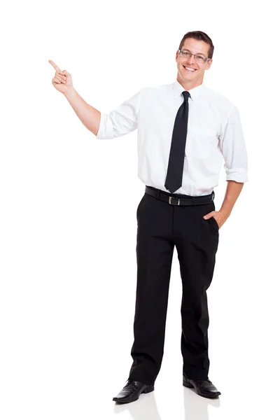 Young businessman pointing at copy space Stock Photo