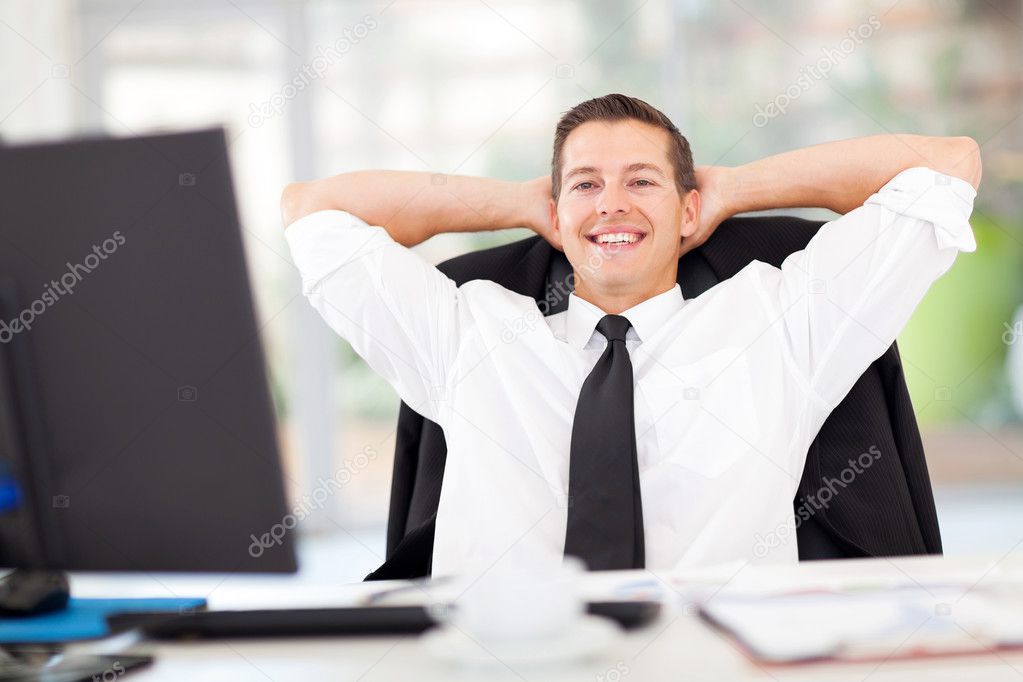 young businessman relaxed in office