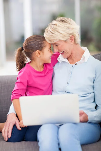 Granddaughter hugging her senior grandmother — Stock Photo, Image