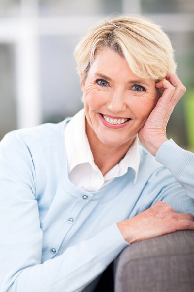 elegant elderly woman sitting at home