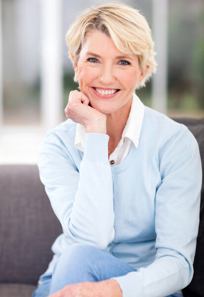 middle aged woman sitting at home