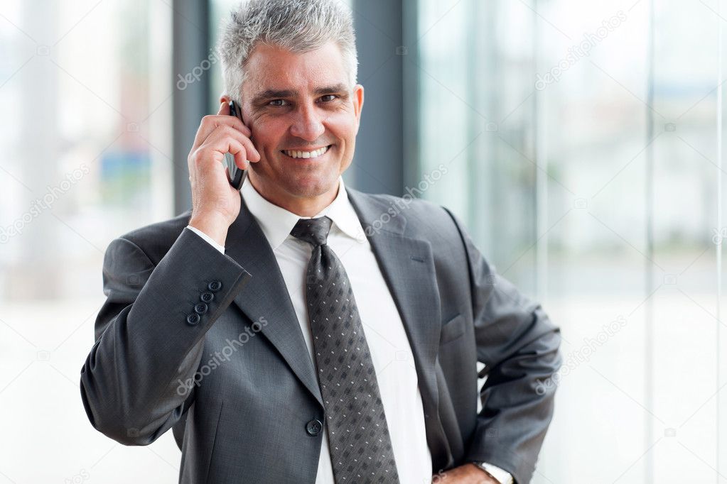 Successful businessman talking on cell phone