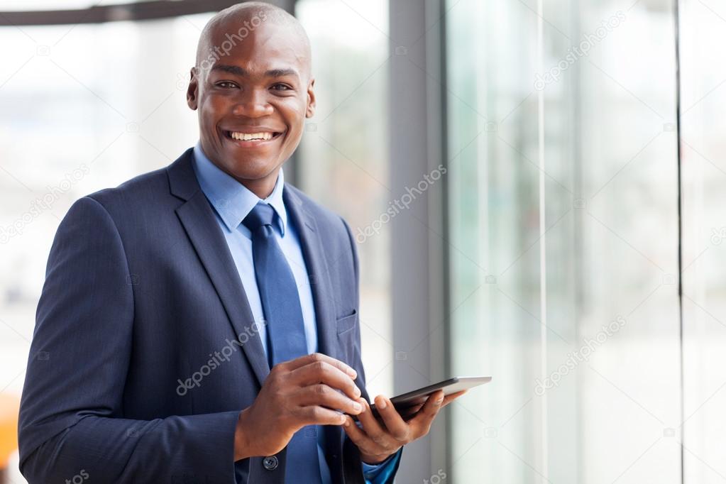 black businessman using tablet pc