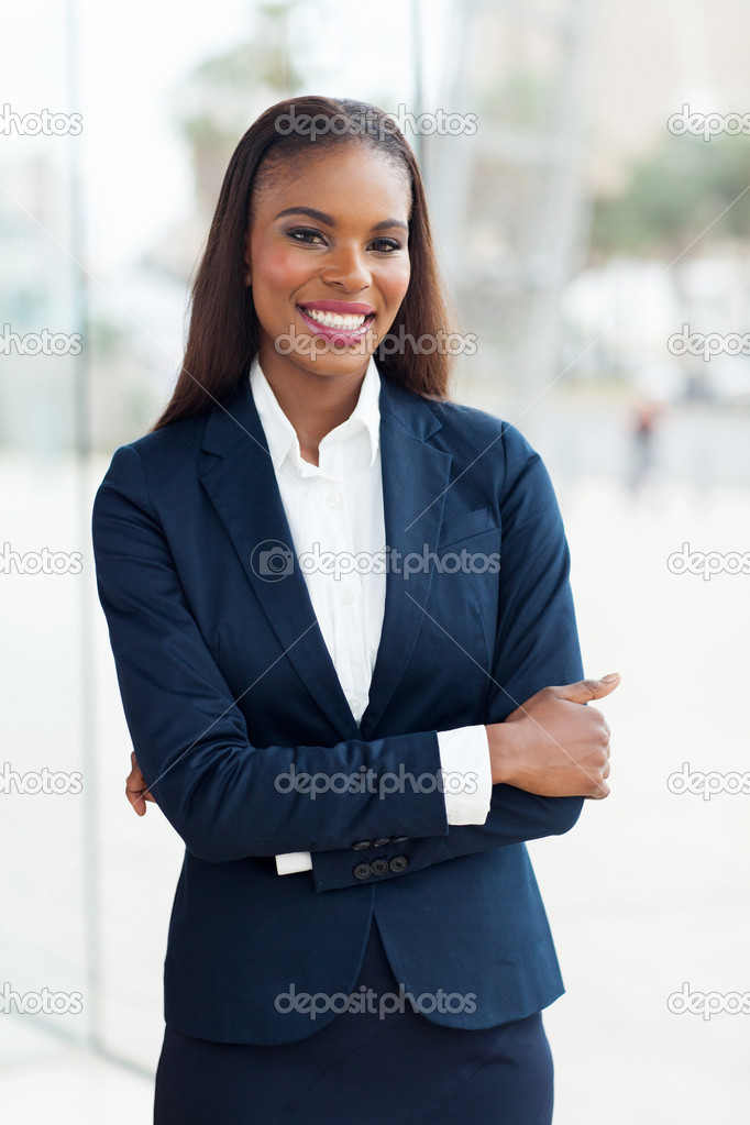 young african businesswoman with arms folded