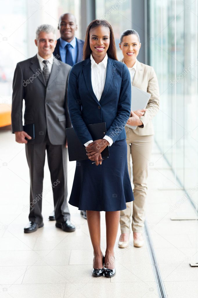 African female business leader with team