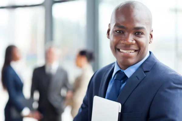 Young african corporate worker in modern office Royalty Free Stock Photos