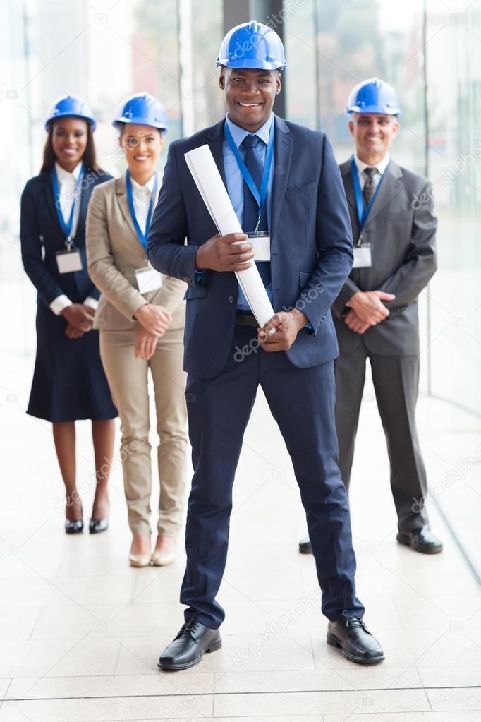 African american architect standing in front of colleagues
