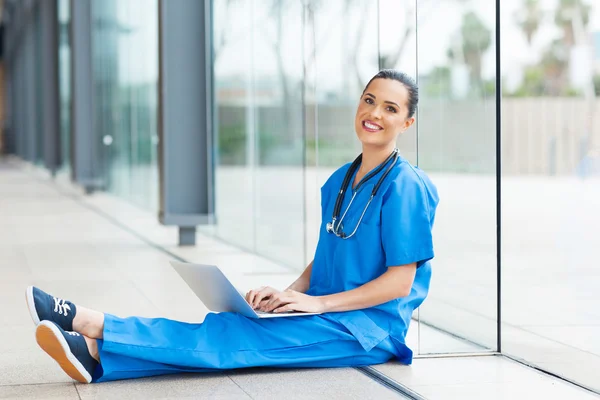 Medical worker sitting on hospital floor — Stock Photo, Image