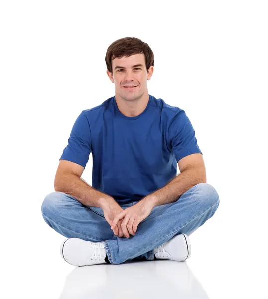 Lindo hombre sentado sobre fondo blanco — Foto de Stock