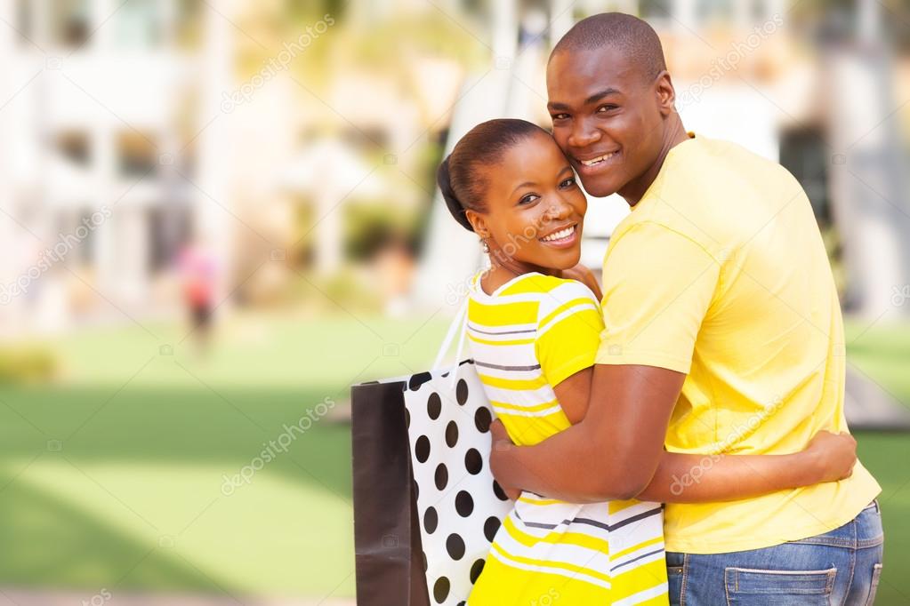 African american couple outside shopping mall
