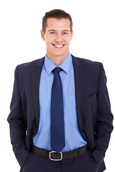 Happy businessman posing with hands in pockets — Stock Photo, Image