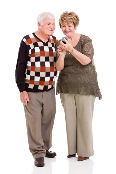 Senior couple using smart phone — Stock Photo, Image