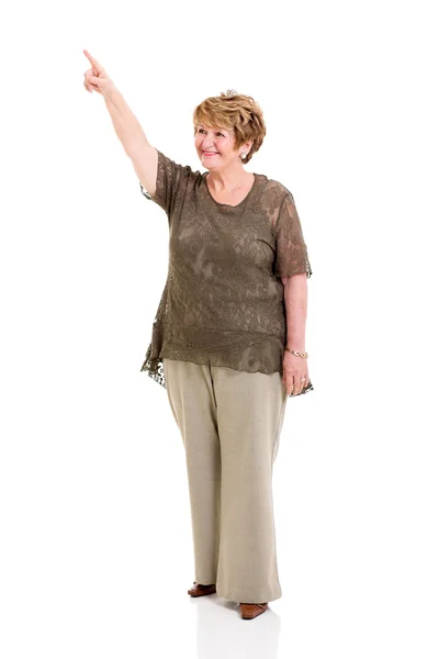 Senior woman pointing up — Stock Photo, Image