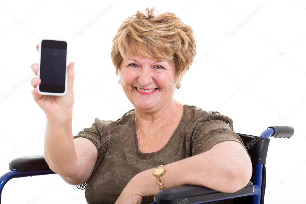 elderly woman in a wheelchair showing a smart phone
