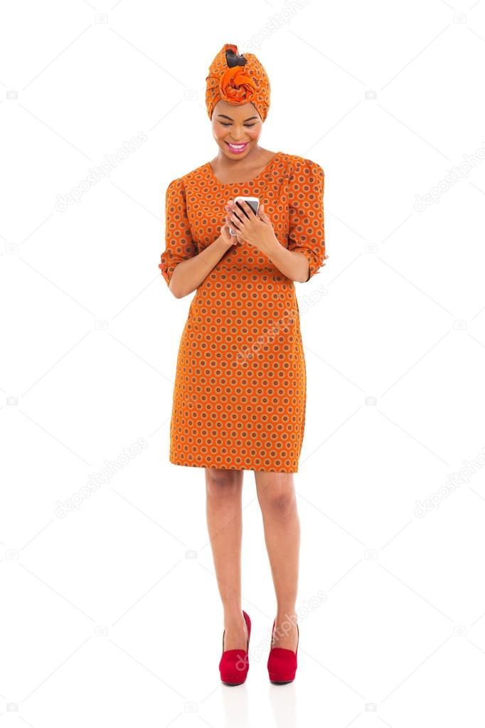african woman reading emails on her smart phone