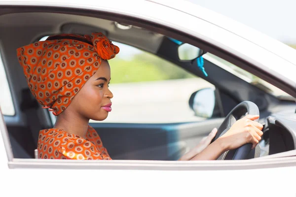 Young african woman driving a car — Stock Photo, Image