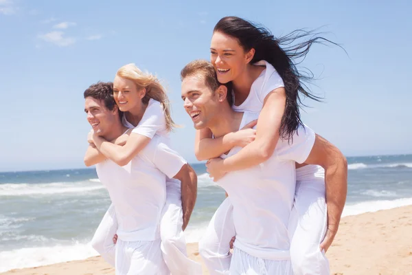 Group of friends piggyback and having fun — Stock Photo, Image