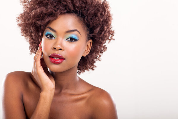 Young afro american female model wearing colorful makeup
